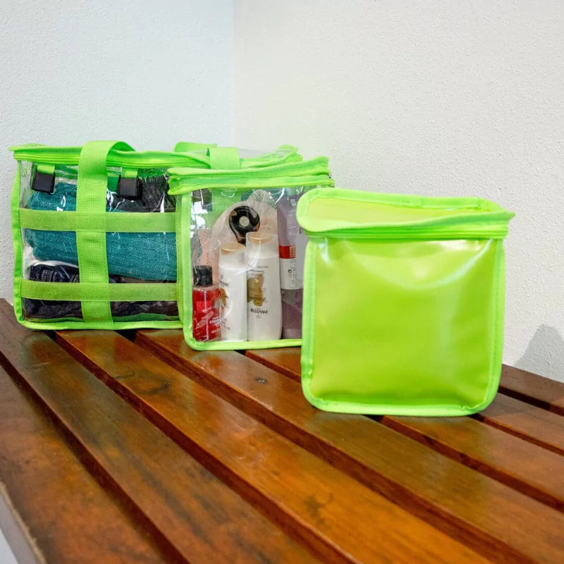 Green clear toiletry bag with detachable  privacy pocket sitting separately on amenities shower bench