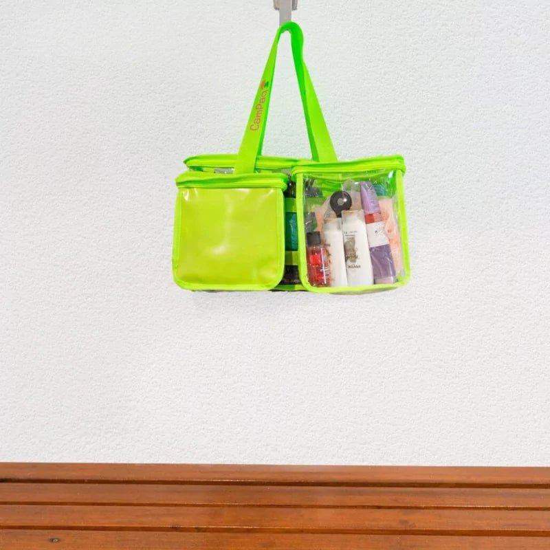 Green clear toiletry bag with privacy pocket and toiletries hanging on bathroom hook on wall