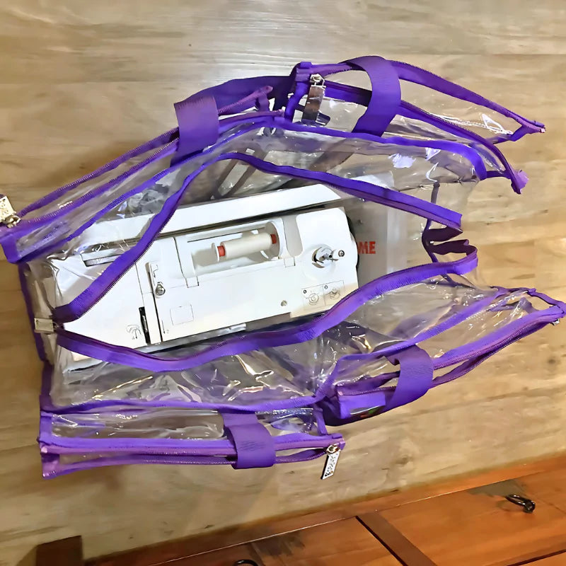 Large clear bag with purple straps containing sewing machine