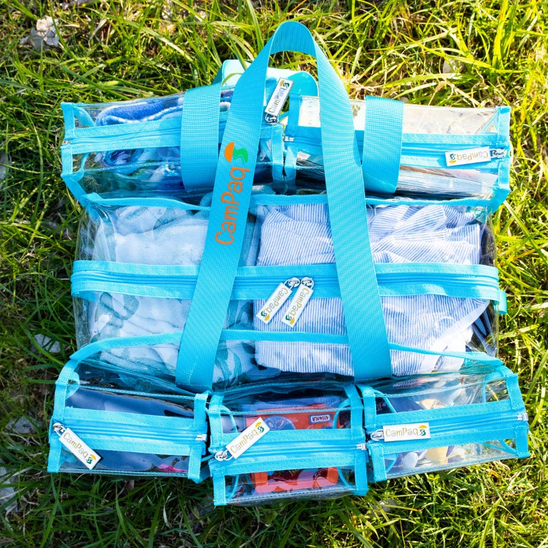 Medium blue clear camping bag showing view from top and handles and  brand logo on grass