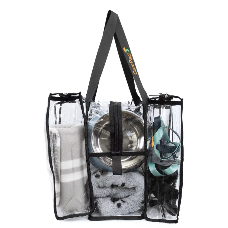 Medium black clear camping bag side view with dog bowl, dog blankets and leads showing handles